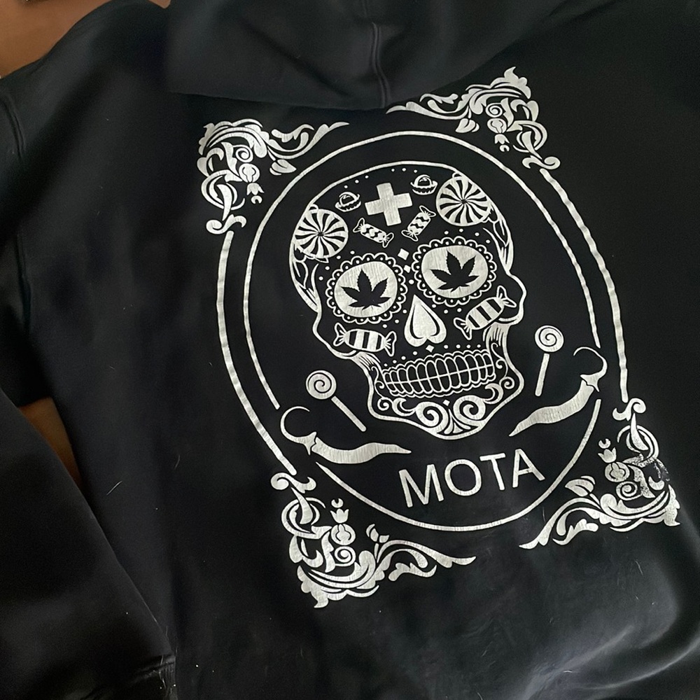 Mota Green Meds black sweater